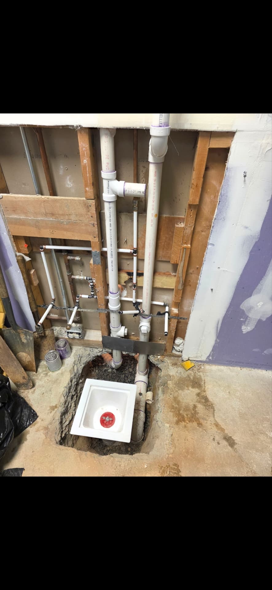 New PVC drain, vent and supply rough-in with laundry box in an opened wall
